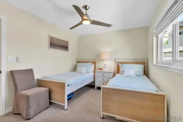 an aerial view of residential building with trees