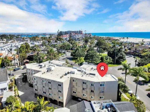 an aerial view of a houses with street