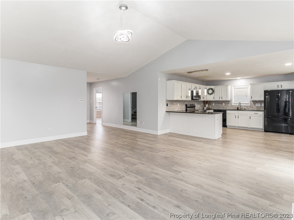 1964 Yellowbrick Road Fayetteville, NC 28314 - Photo 11 of 37 a view of kitchen with wooden floor