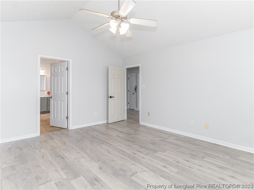 1964 Yellowbrick Road Fayetteville, NC 28314 - Photo 16 of 37 an empty room with fan and a ceiling fan