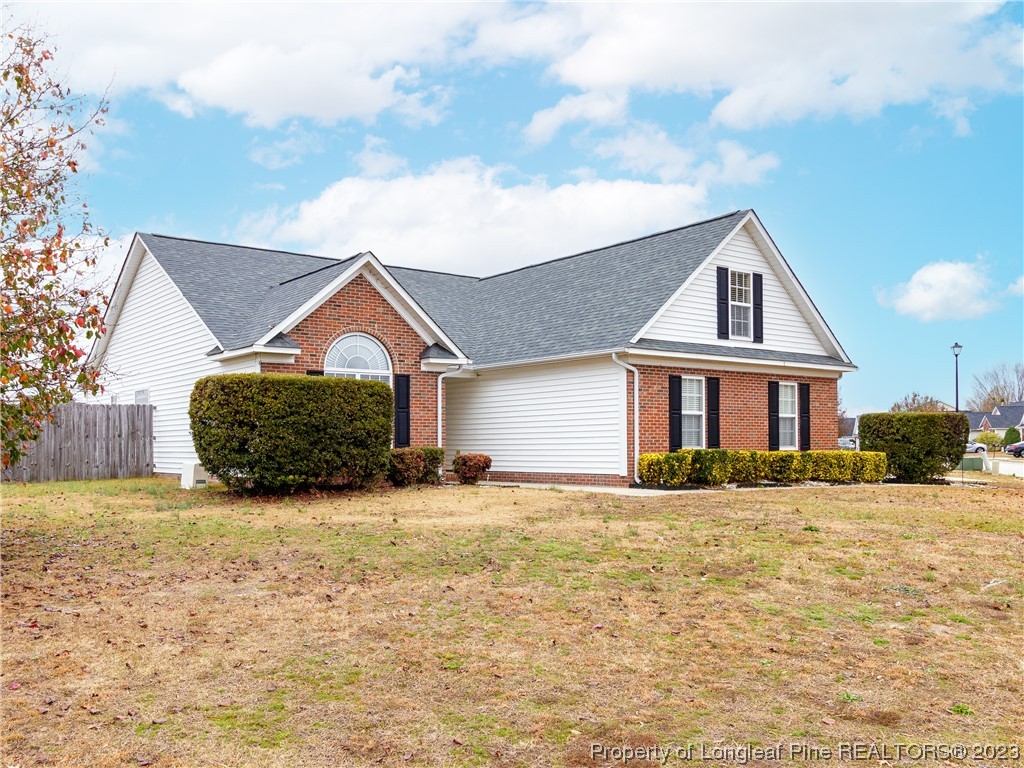 1964 Yellowbrick Road Fayetteville, NC 28314 - Photo 2 of 37 a front view of a house with a yard
