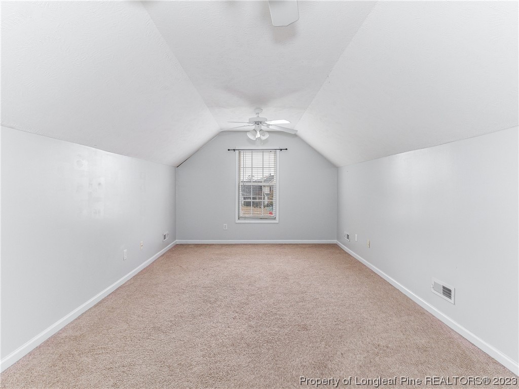 1964 Yellowbrick Road Fayetteville, NC 28314 - Photo 31 of 37 an empty room with a empty space and windows