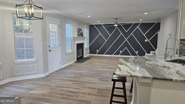 a view of room with wooden floor