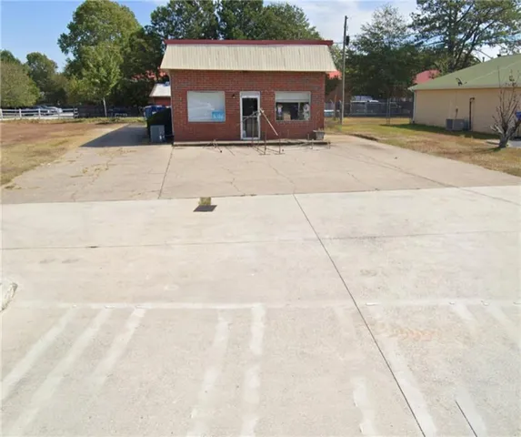 a front view of a house with a yard and a garage