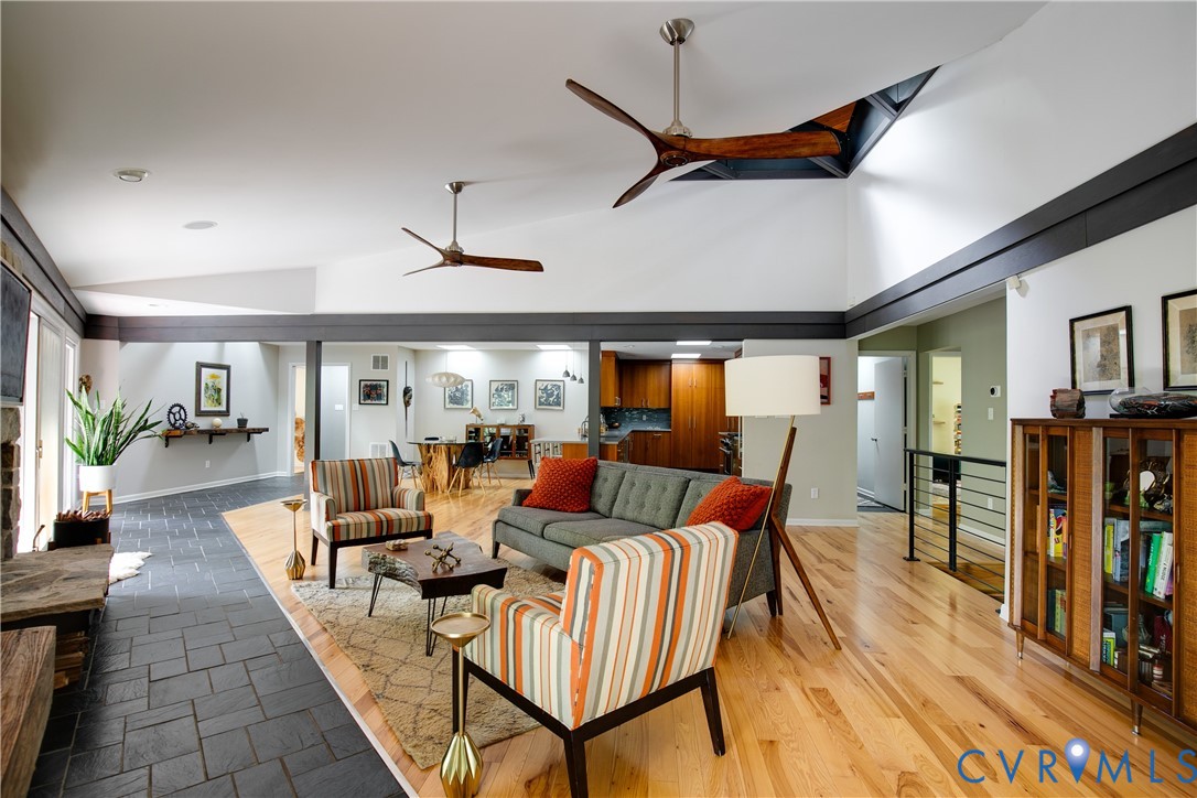 380 Flag Station Road Henrico, VA 23238 - Photo 13 of 70 a living room with furniture a ceiling fan and a rug
