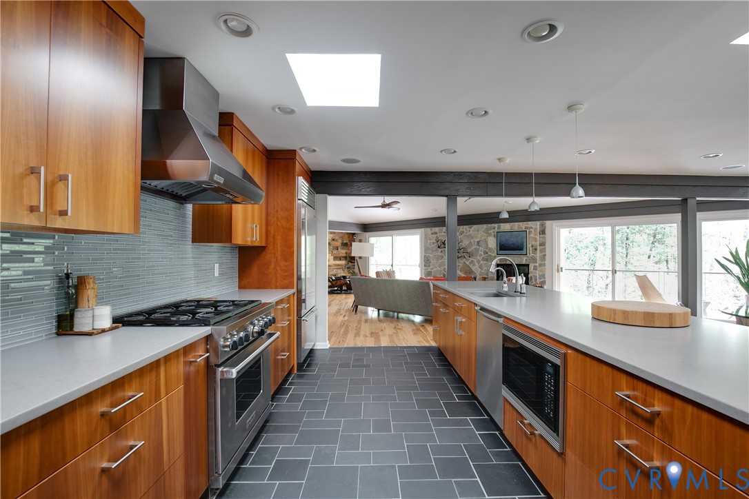 380 Flag Station Road Henrico, VA 23238 - Photo 20 of 70 a kitchen with stainless steel appliances a sink stove and cabinets