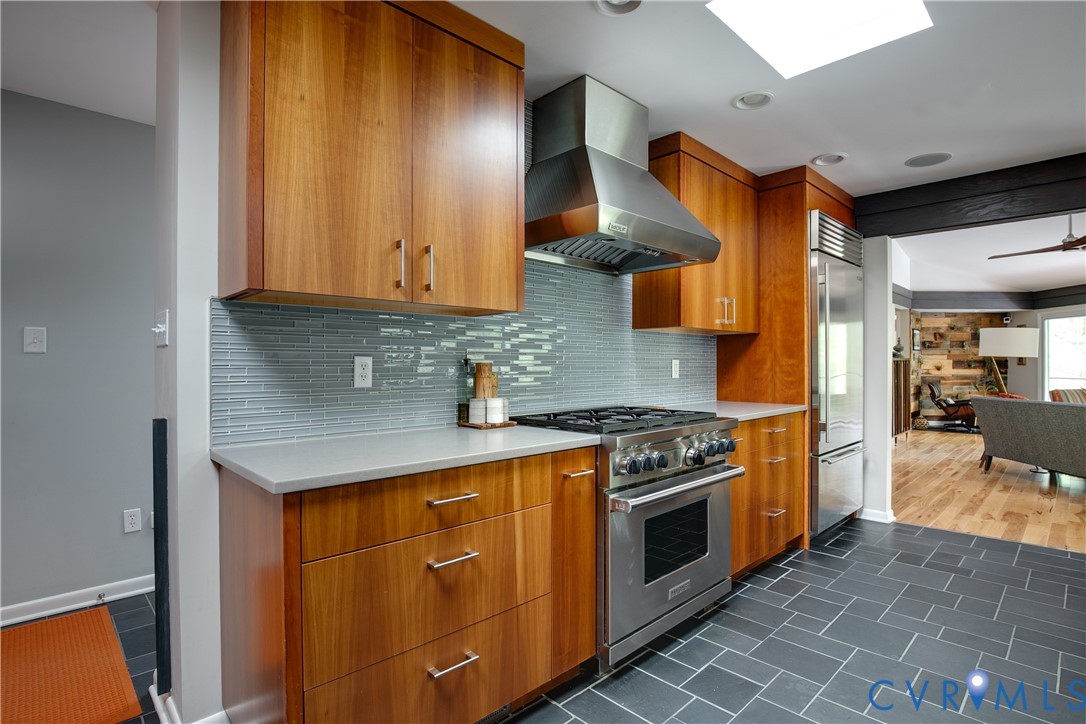 380 Flag Station Road Henrico, VA 23238 - Photo 21 of 70 a kitchen with stainless steel appliances granite countertop a stove a sink and a refrigerator