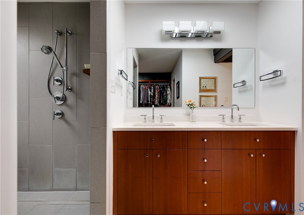 380 Flag Station Road Henrico, VA 23238 - Photo 36 of 70 a bathroom with a sink and a mirror