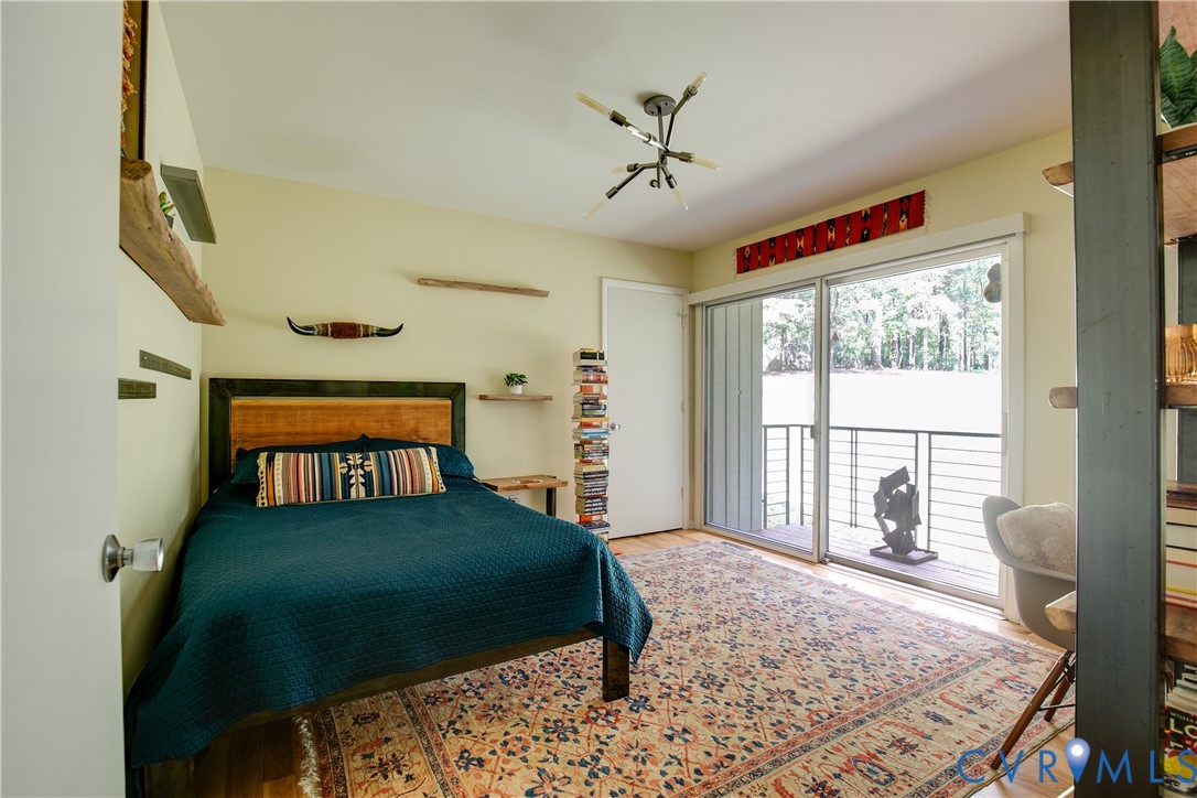 380 Flag Station Road Henrico, VA 23238 - Photo 42 of 70 a bedroom with a bed and a window