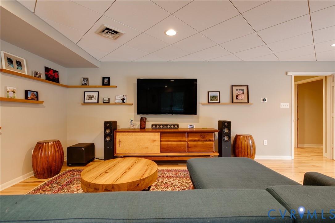 380 Flag Station Road Henrico, VA 23238 - Photo 48 of 70 a living room with furniture and a flat screen tv
