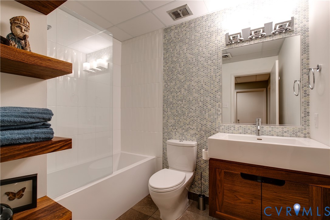 380 Flag Station Road Henrico, VA 23238 - Photo 50 of 70 a bathroom with a sink toilet and shower