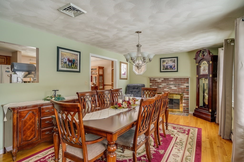 1109 Whipple Road Tewksbury, MA 01876 - Photo 12 of 25 a view of a dining room with furniture