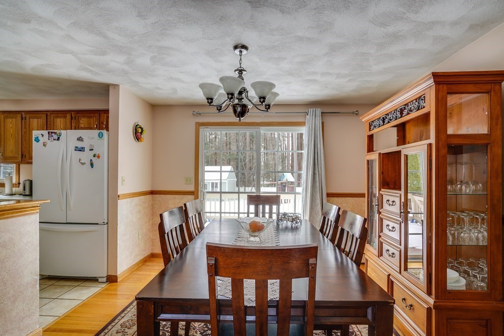 1109 Whipple Road Tewksbury, MA 01876 - Photo 14 of 25 a view of a dining room with furniture window and outside view