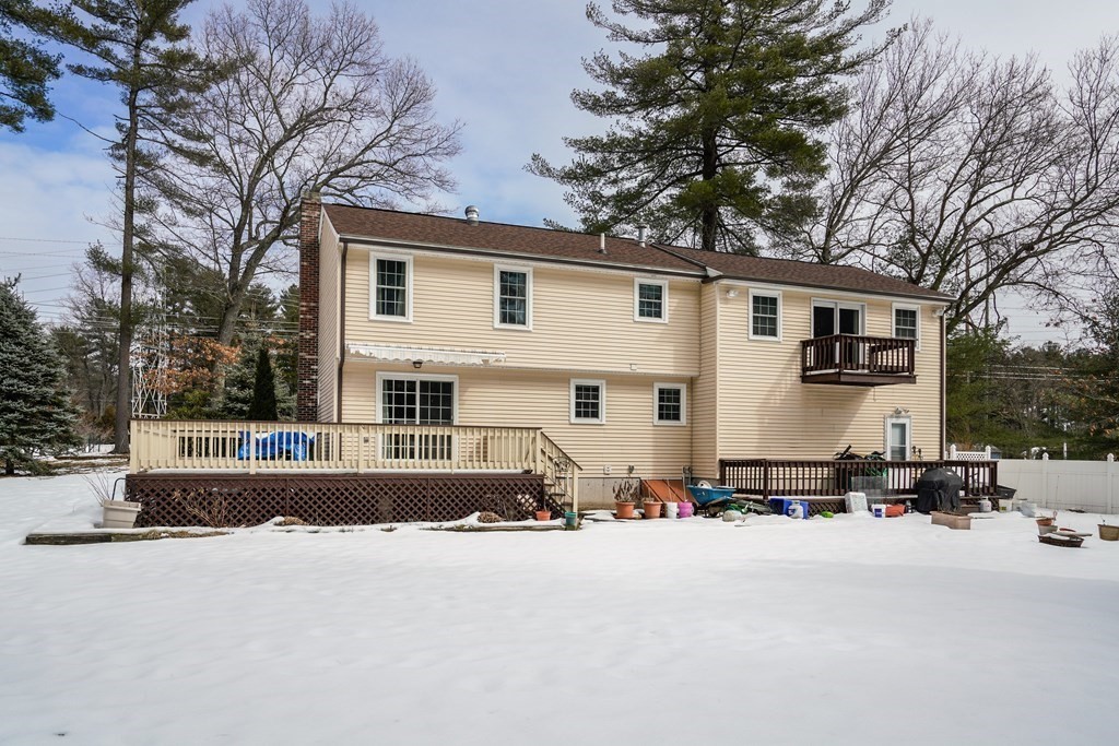 1109 Whipple Road Tewksbury, MA 01876 - Photo 23 of 25 a view of a house with snow on the road