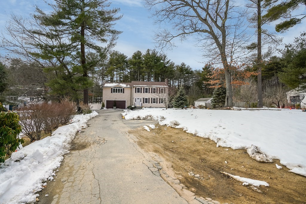 1109 Whipple Road Tewksbury, MA 01876 - Photo 25 of 25 a view of a house with snow on the road