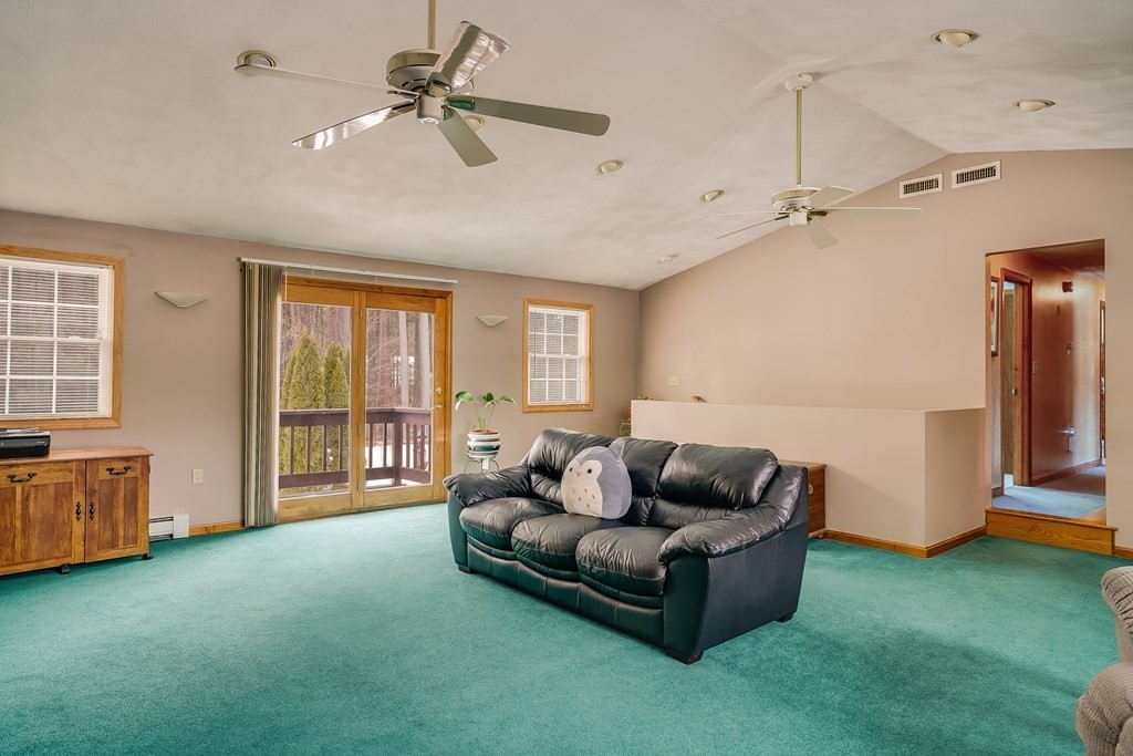 1109 Whipple Road Tewksbury, MA 01876 - Photo 4 of 25 a living room with furniture and a window