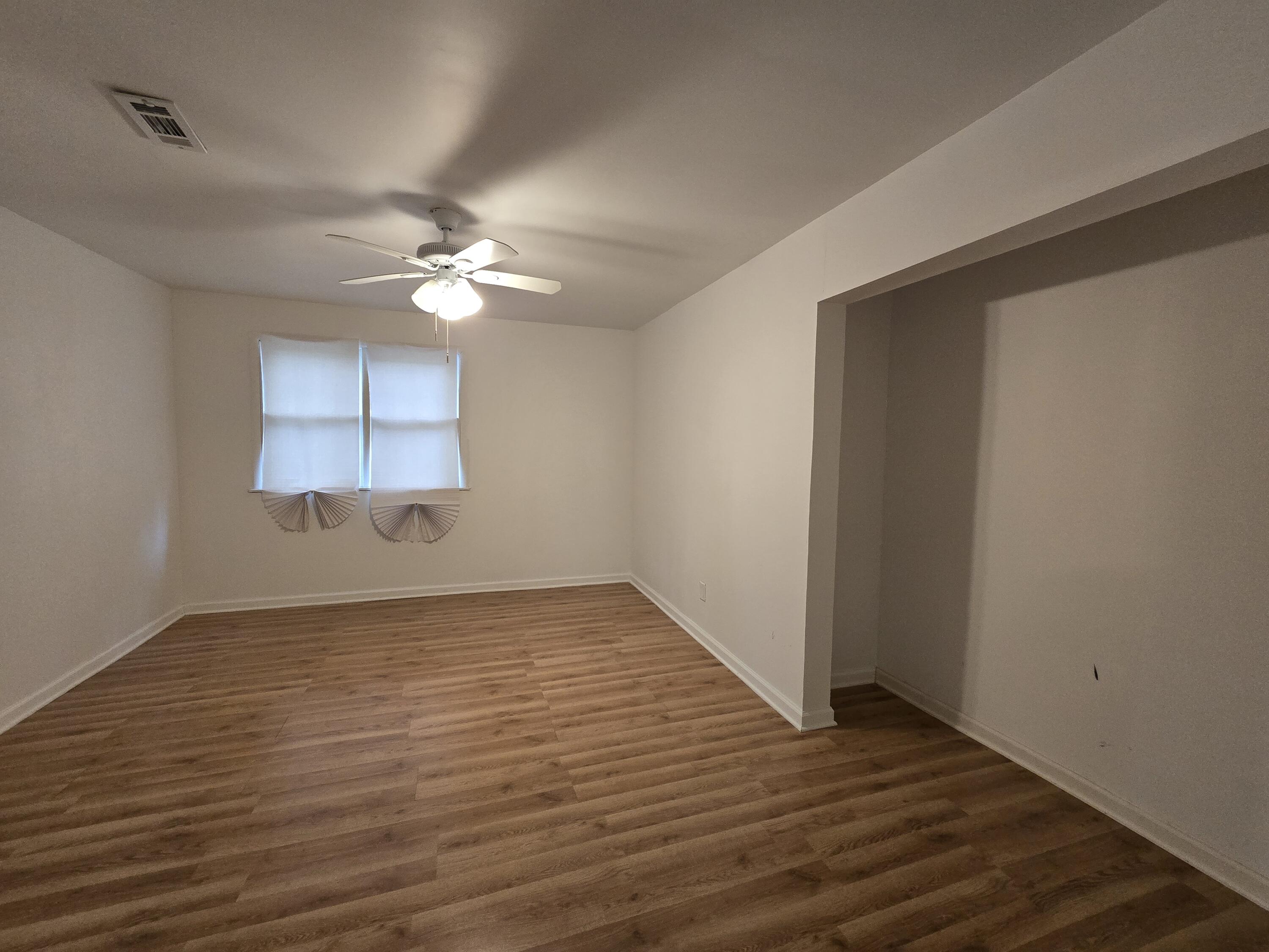 2128 Tennessee Street Gary, IN 46407 - Photo 19 of 26 wooden floor in an empty room with a window
