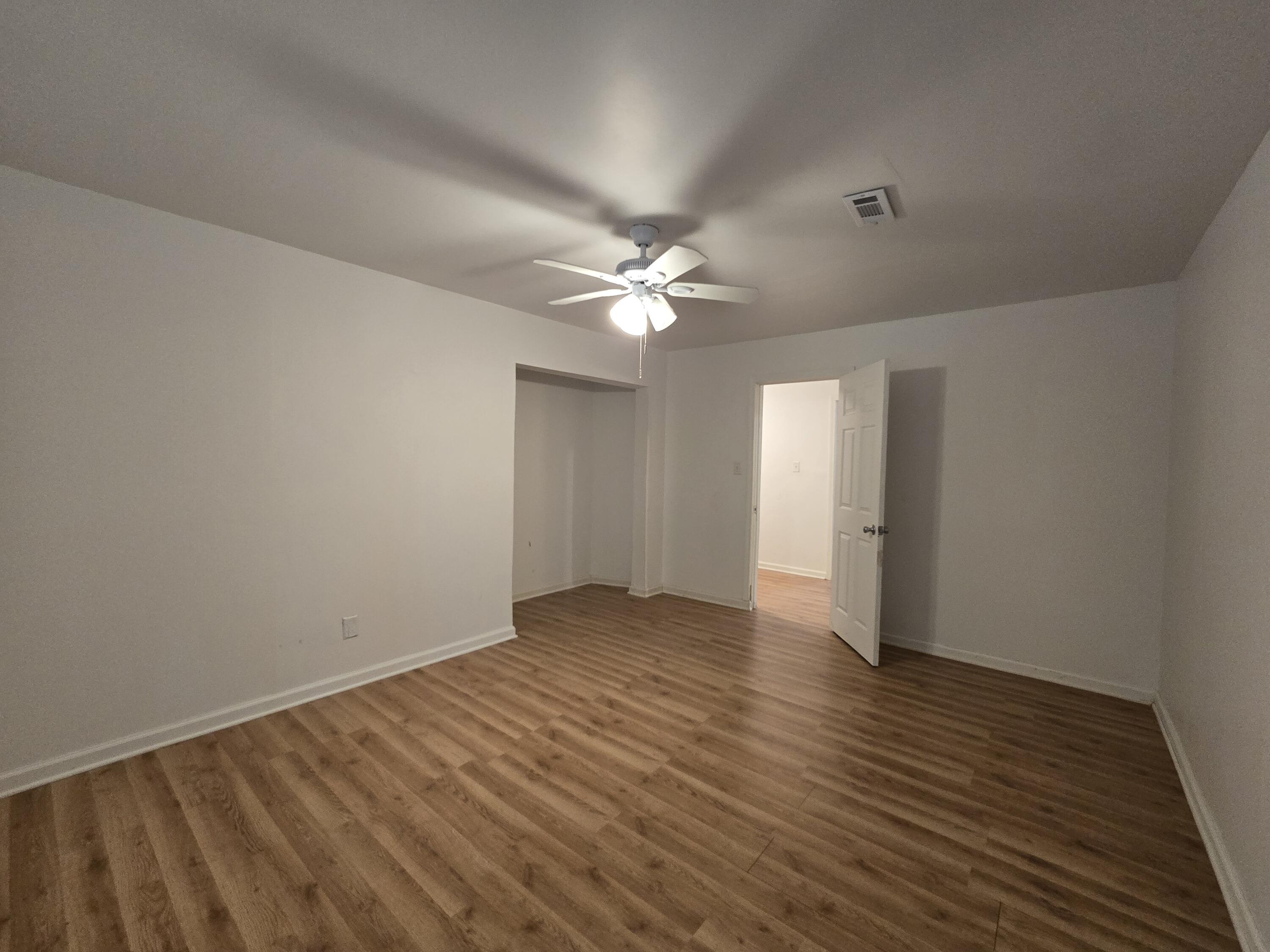 2128 Tennessee Street Gary, IN 46407 - Photo 20 of 26 wooden floor in an empty room with a window