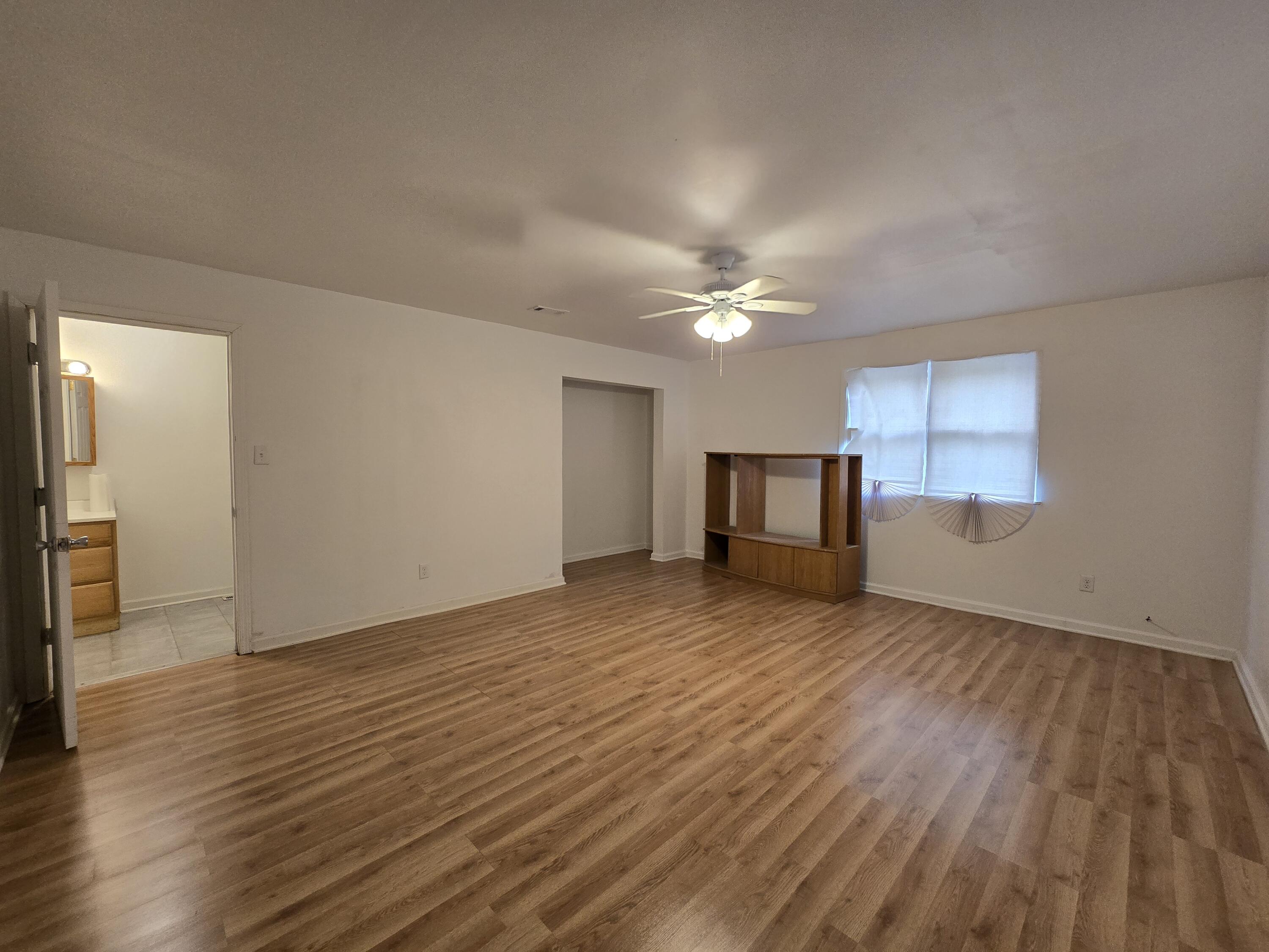 2128 Tennessee Street Gary, IN 46407 - Photo 23 of 26 a view of a livingroom with wooden floor and chandelier
