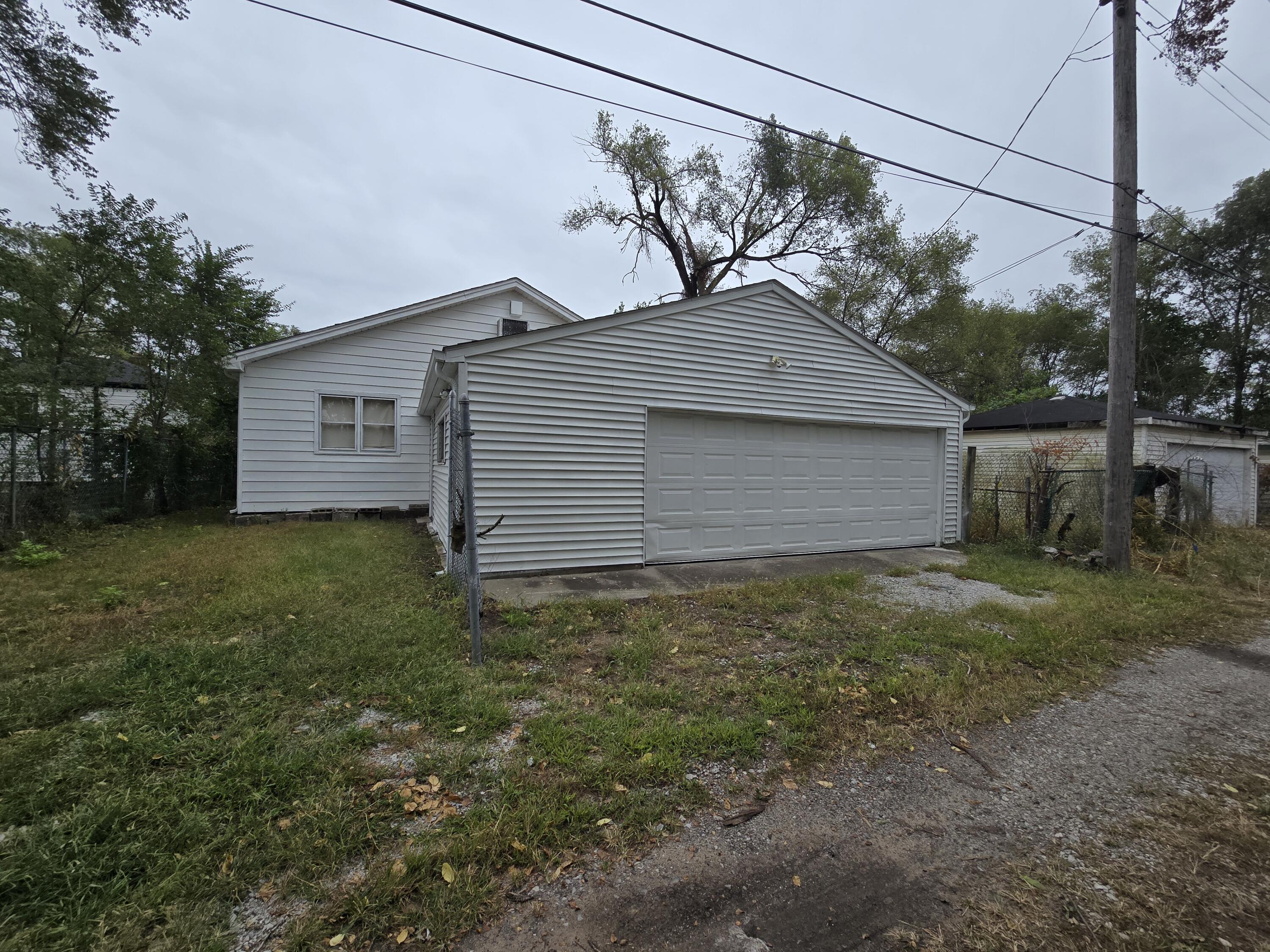 2128 Tennessee Street Gary, IN 46407 - Photo 26 of 26 a backyard of a house with lots of green space
