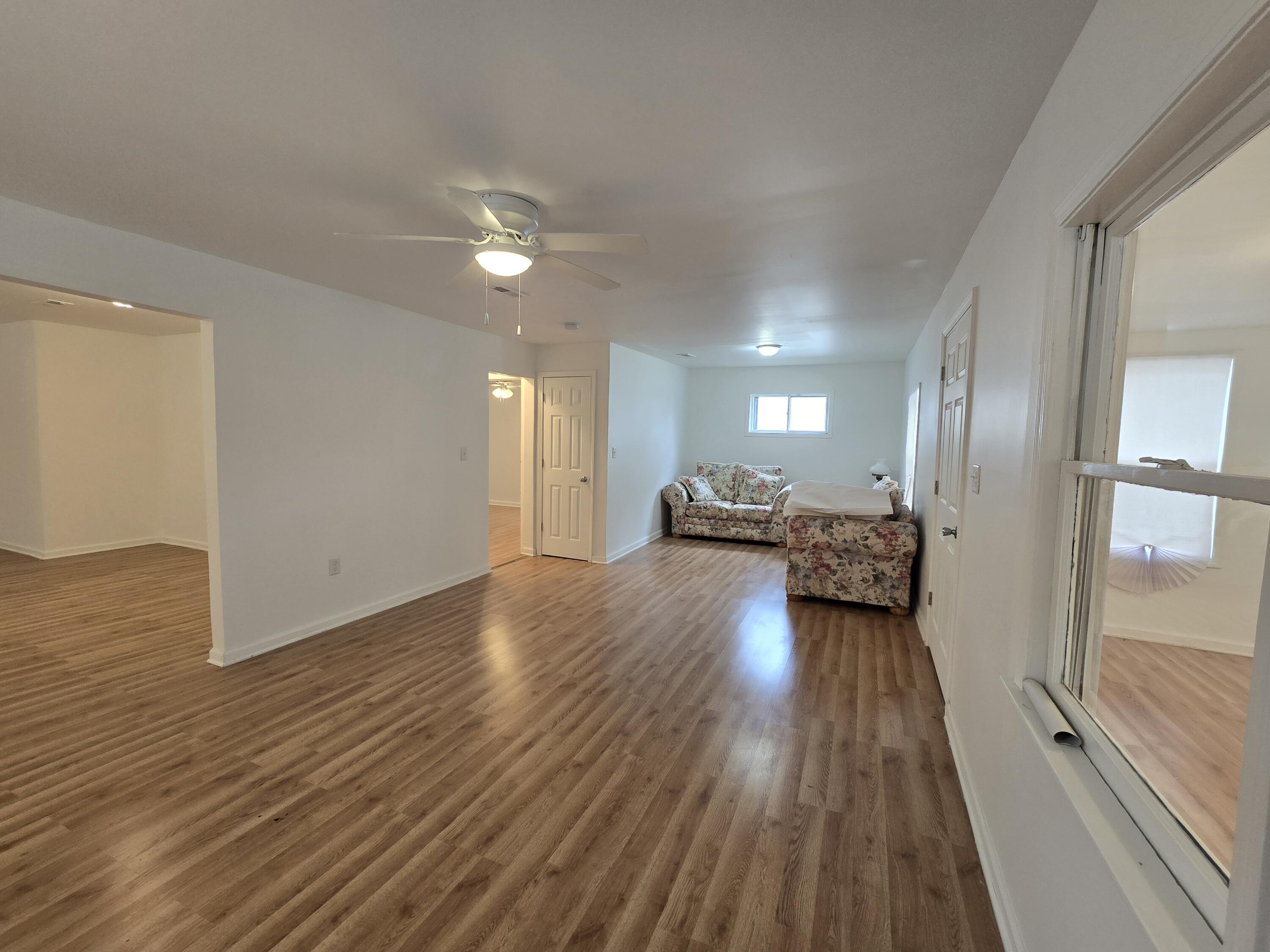 2128 Tennessee Street Gary, IN 46407 - Photo 5 of 26 a view of a living room hardwood floor and a kitchen