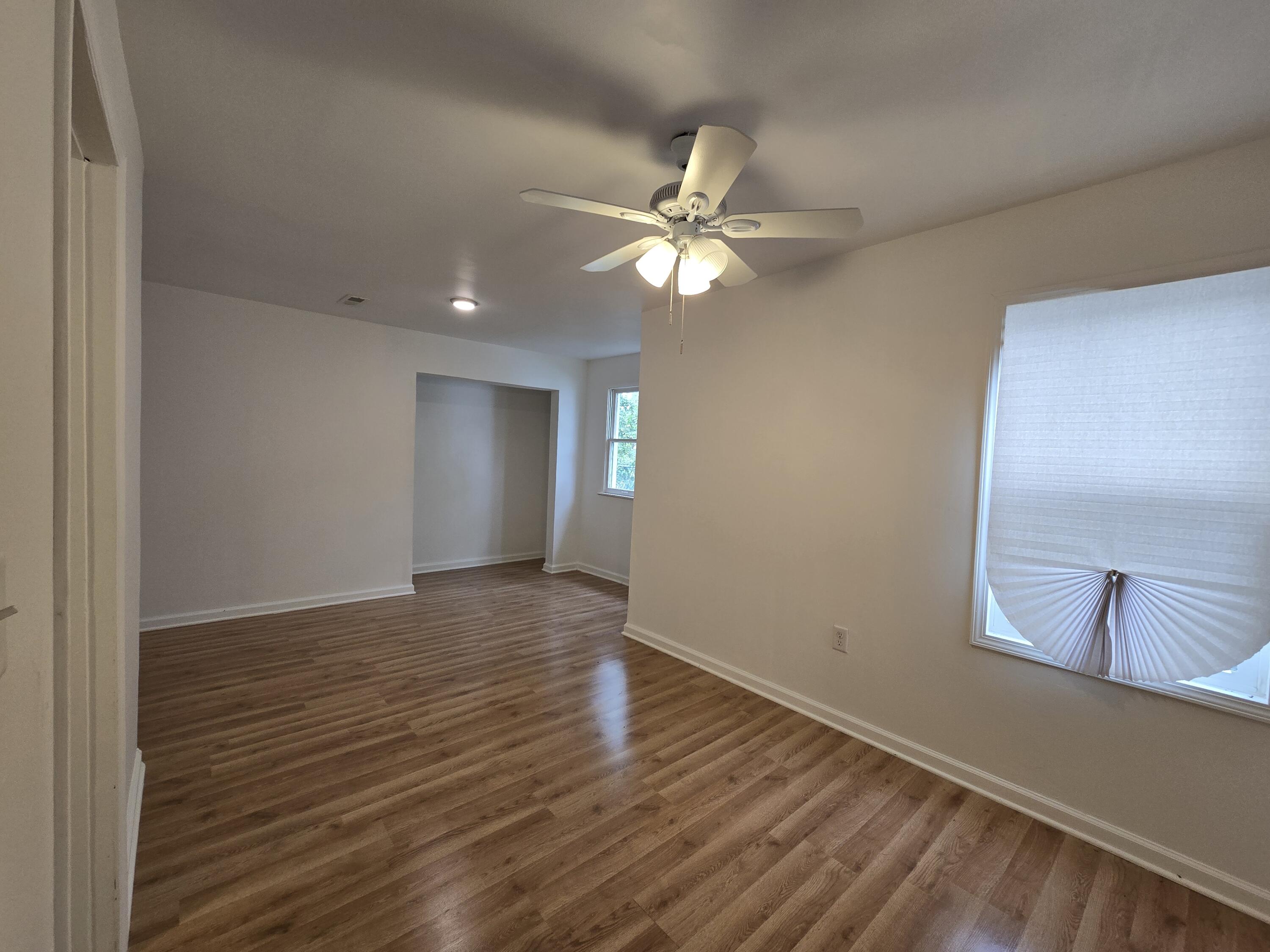 2128 Tennessee Street Gary, IN 46407 - Photo 7 of 26 wooden floor in an empty room with a window