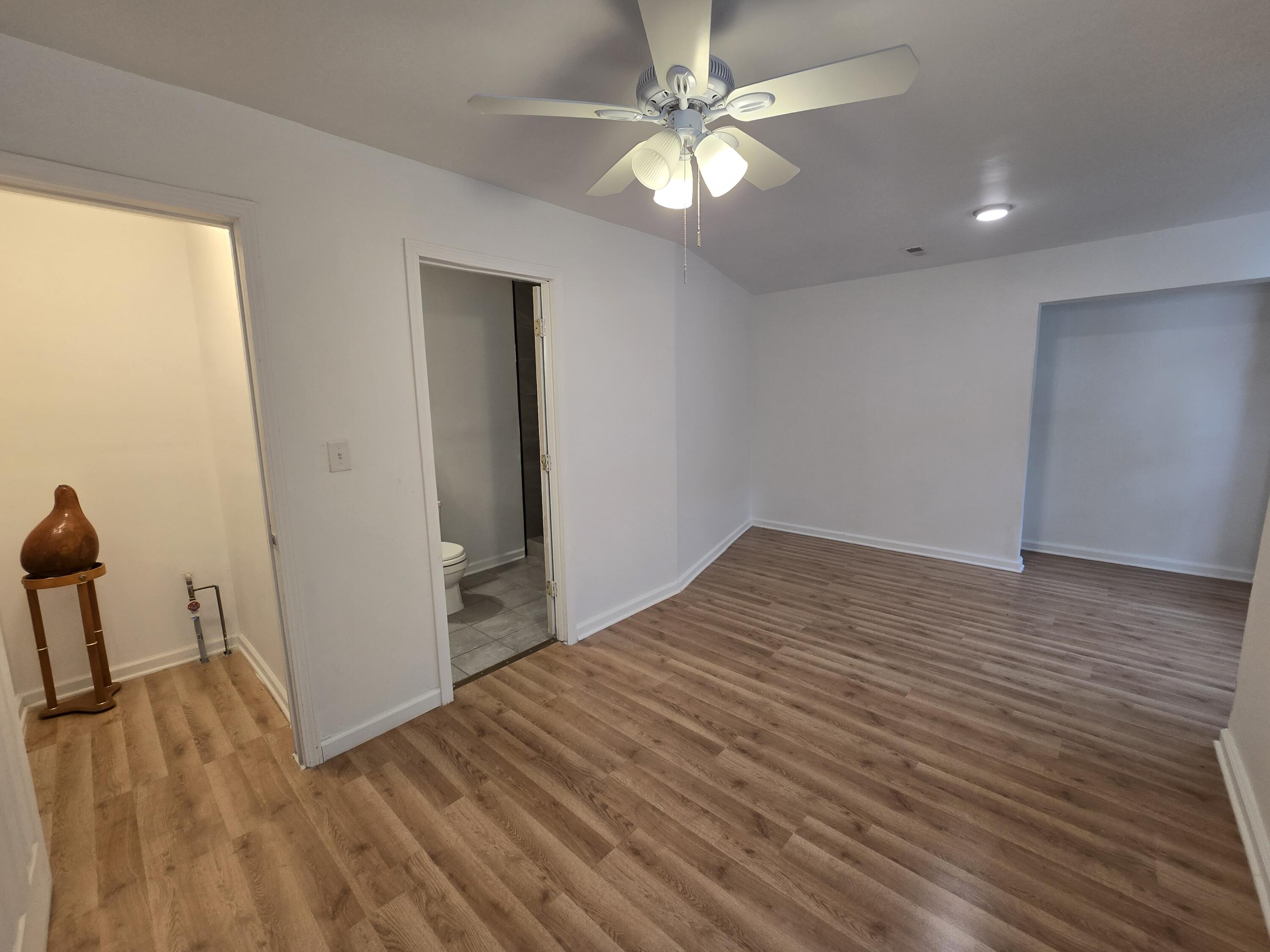 2128 Tennessee Street Gary, IN 46407 - Photo 8 of 26 wooden floor in an empty room with a window