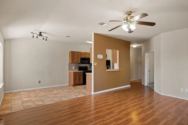 a view of a livingroom with wooden floor
