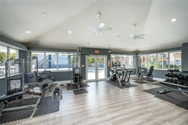 a living room with furniture large window and livingroom view