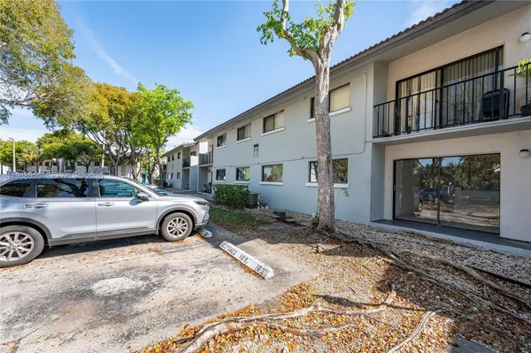 a view of a car in front of a house