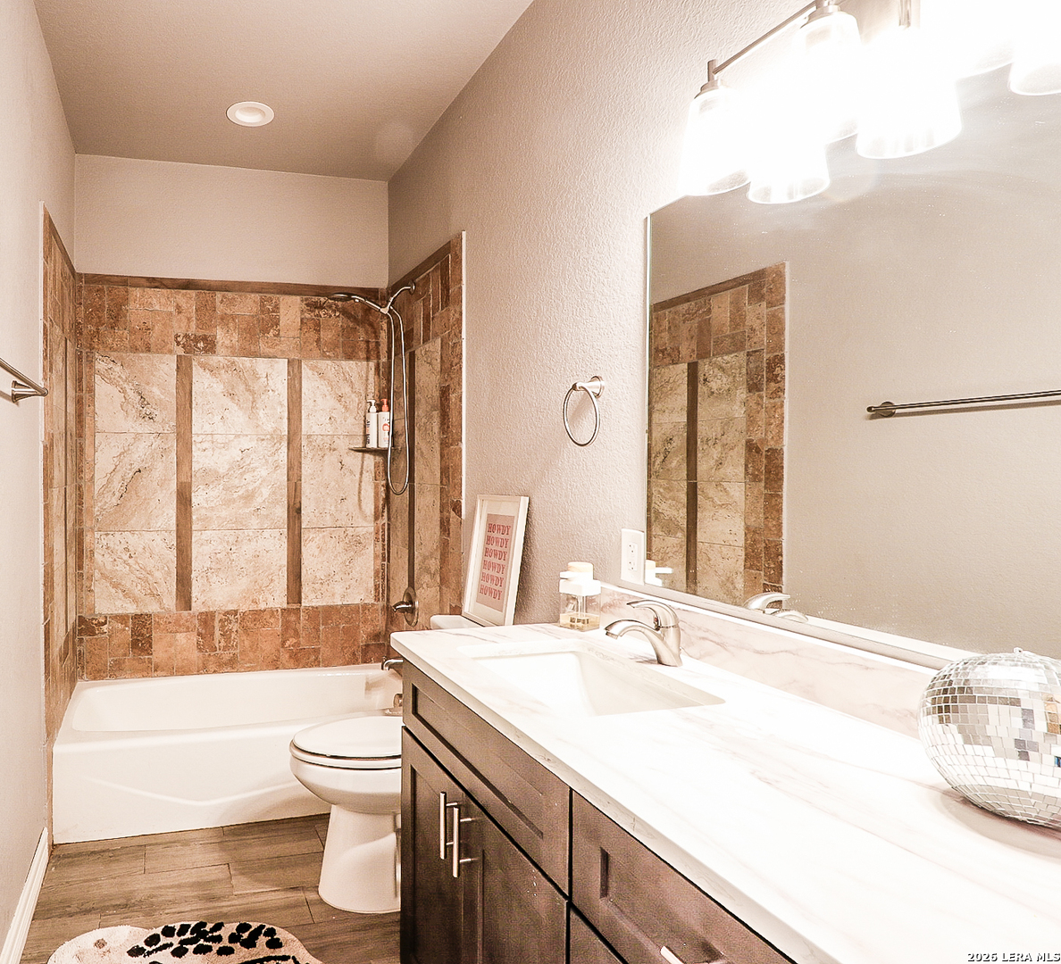 281 Legend Hills Uvalde, TX 78801 - Photo 11 of 24 a bathroom with a sink a toilet and a large mirror
