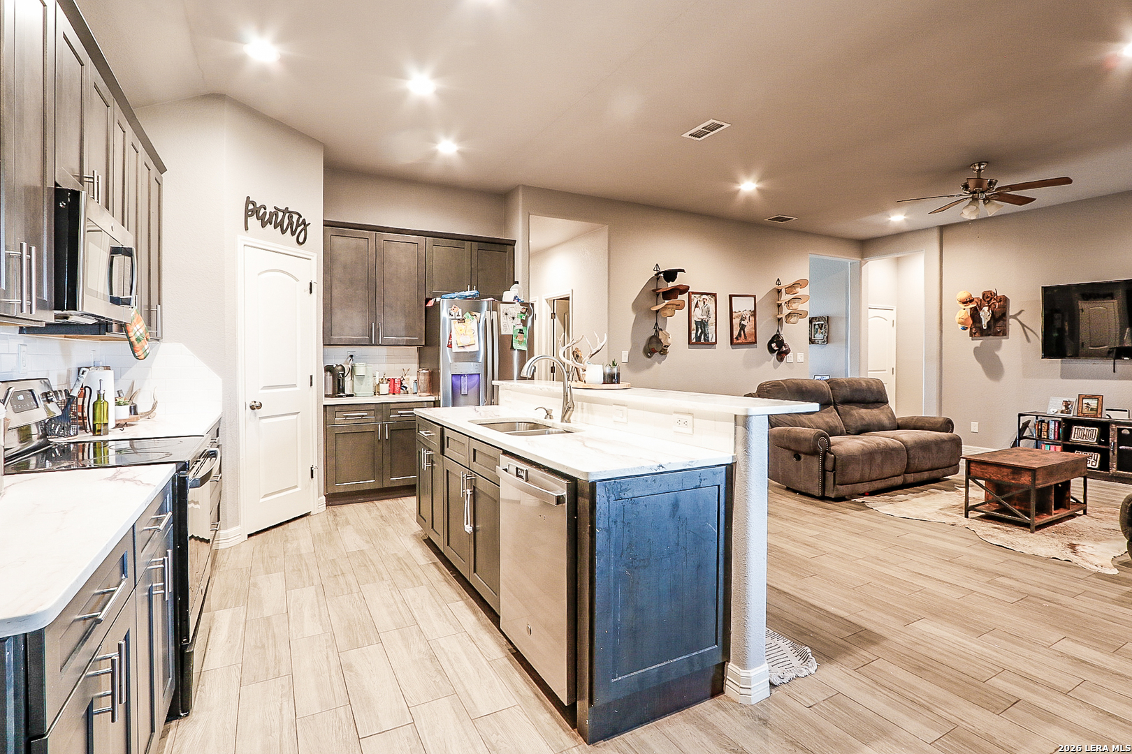 281 Legend Hills Uvalde, TX 78801 - Photo 17 of 24 a large kitchen with stainless steel appliances a sink a stove and a refrigerator