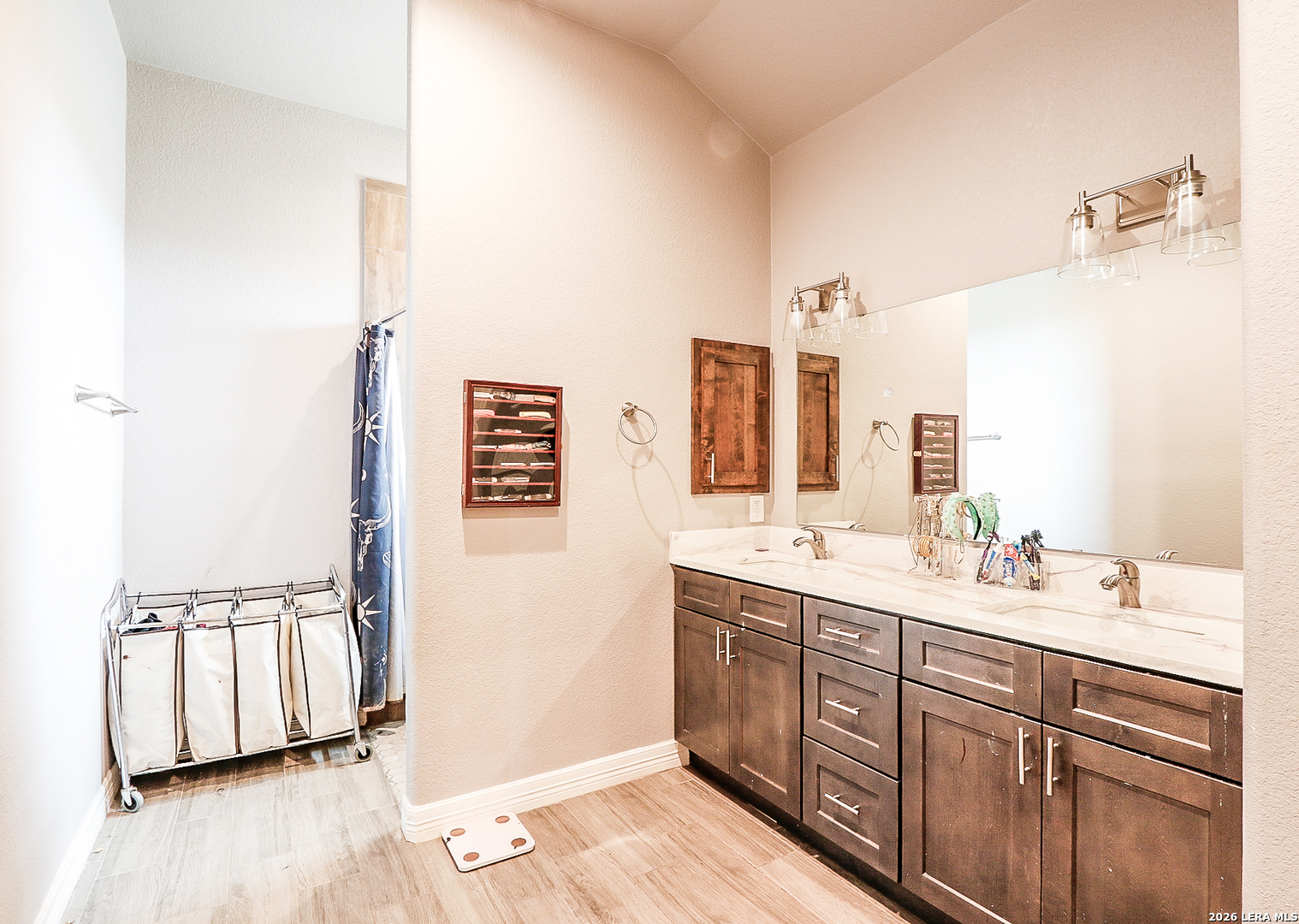 281 Legend Hills Uvalde, TX 78801 - Photo 19 of 24 a bathroom with a double vanity sink and mirror