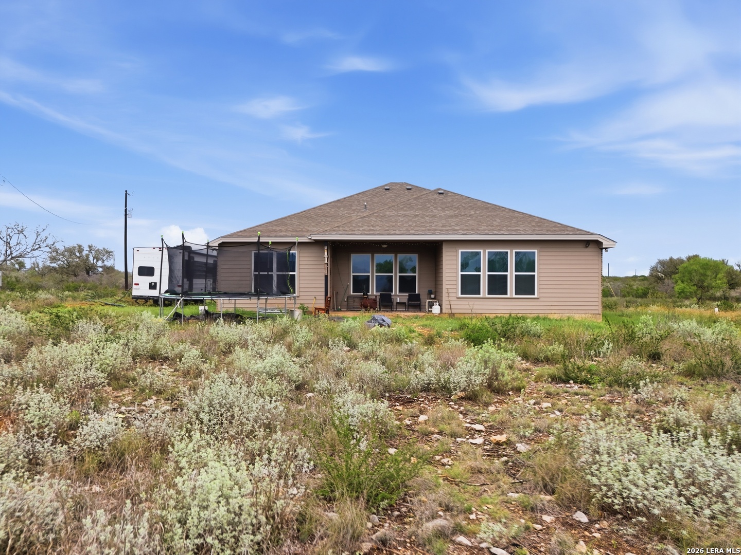 281 Legend Hills Uvalde, TX 78801 - Photo 21 of 24 a front view of a house with a yard