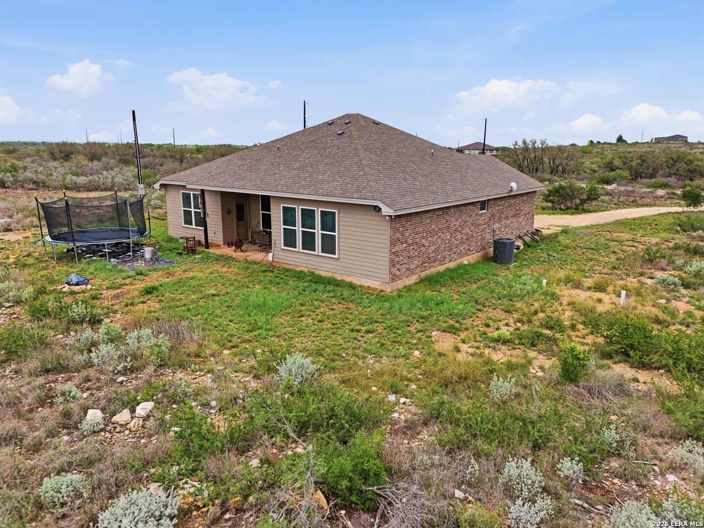 281 Legend Hills Uvalde, TX 78801 - Photo 22 of 24 a view of a house with a yard