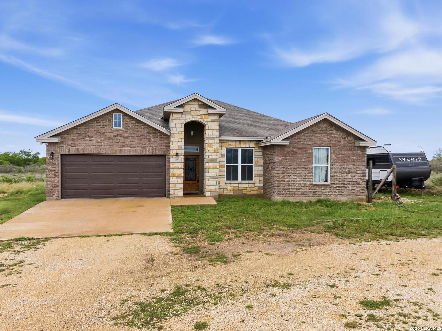 281 Legend Hills Uvalde, TX 78801 - Photo 6 of 24 a front view of a house with garden