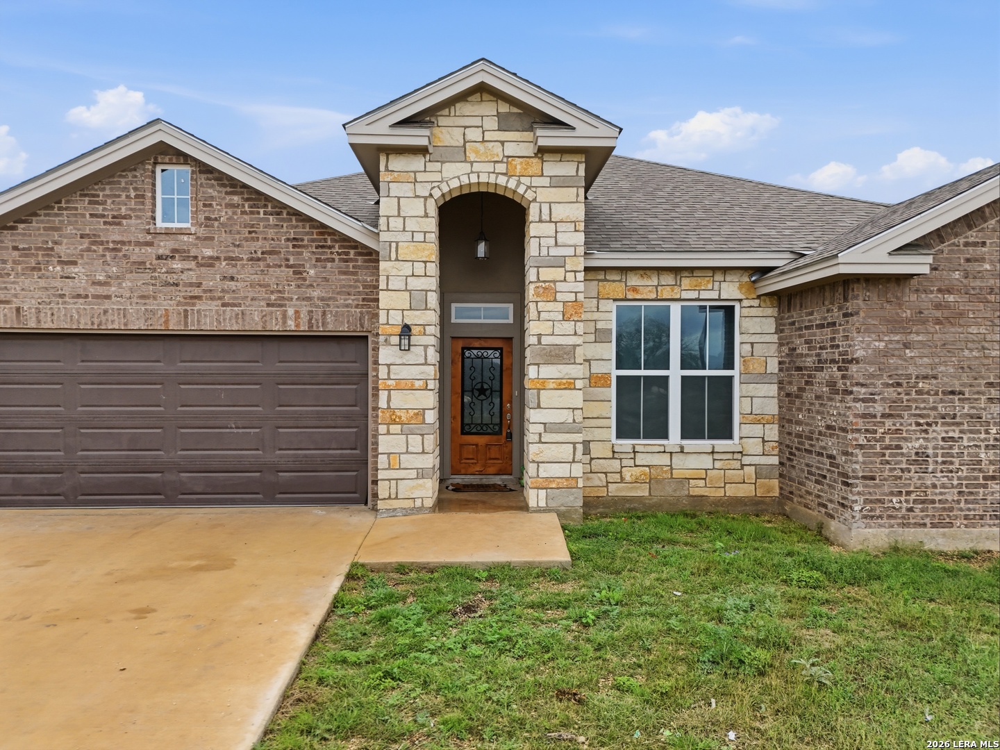281 Legend Hills Uvalde, TX 78801 - Photo 7 of 24 a front view of a house with garden