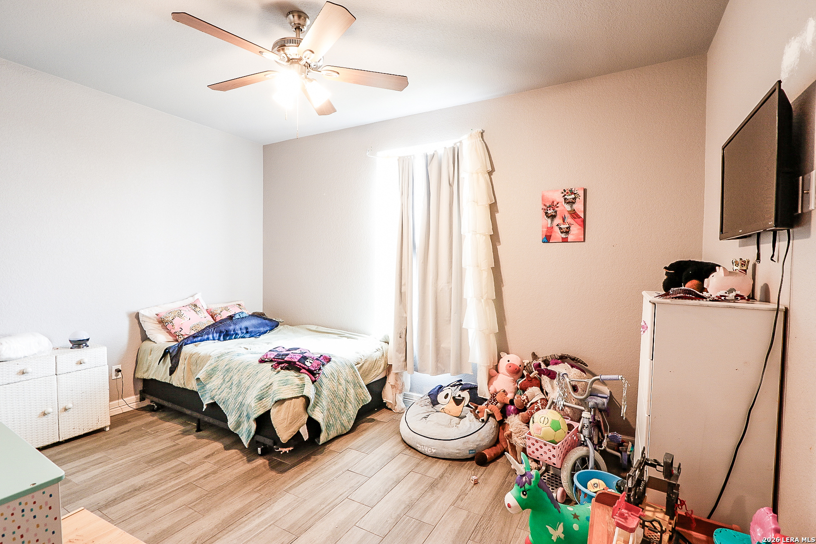 281 Legend Hills Uvalde, TX 78801 - Photo 10 of 24 a bedroom with a bed and a tv