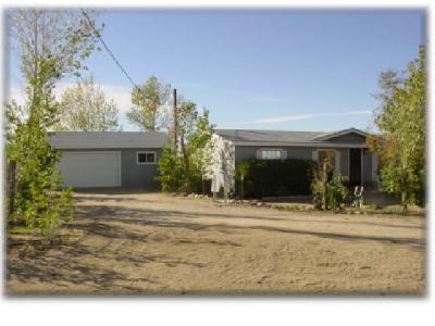 11176 Oasis Road Pinon Hills, CA 92372 - Photo 1 of 1 a front view of a house with porch