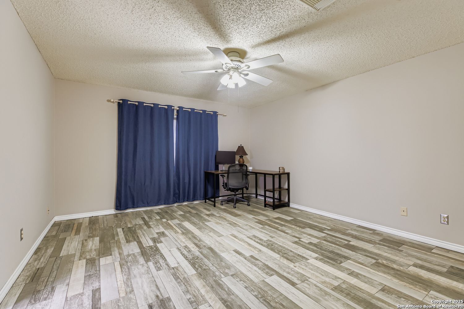 8614 Cross Spring San Antonio, TX 78251 - Photo 12 of 24 a view of a room with a ceiling fan