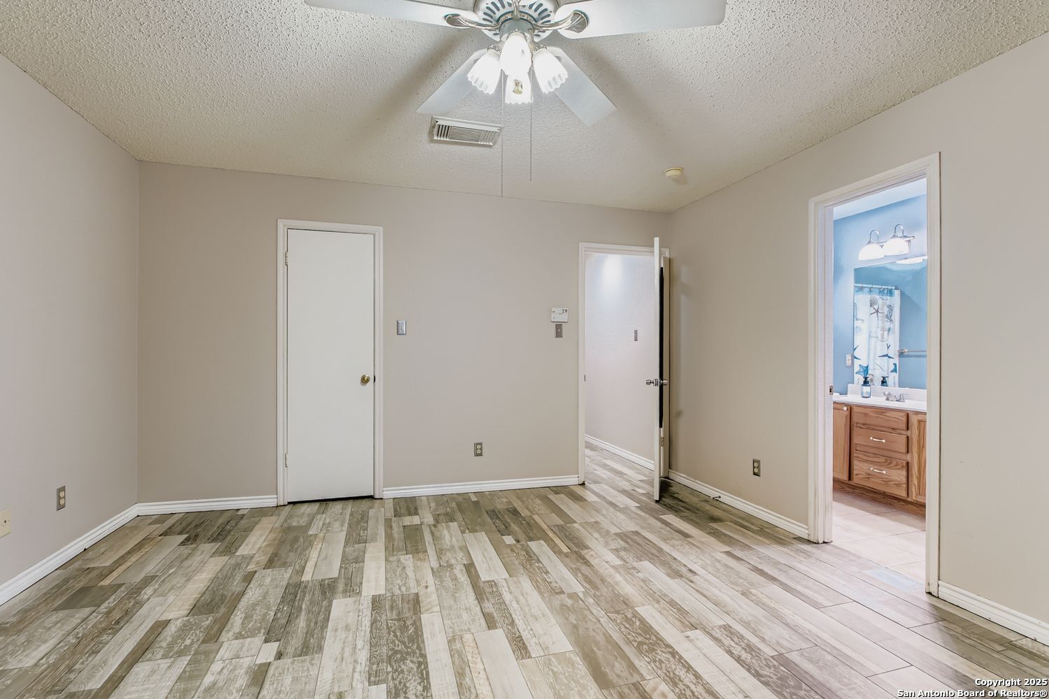 8614 Cross Spring San Antonio, TX 78251 - Photo 14 of 24 a view of empty room with wooden floor