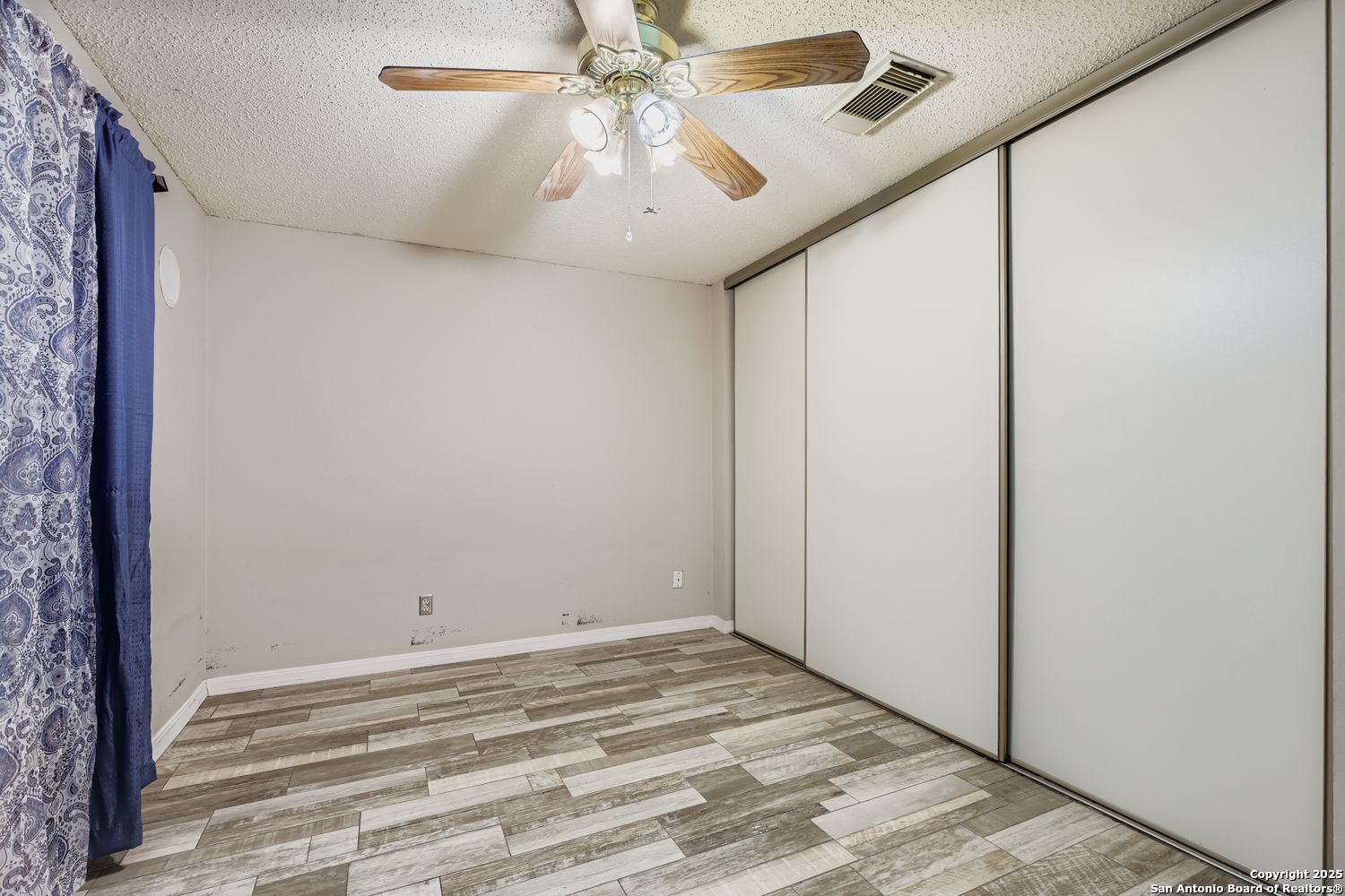 8614 Cross Spring San Antonio, TX 78251 - Photo 17 of 24 a view of a livingroom with a ceiling fan and chandelier fan