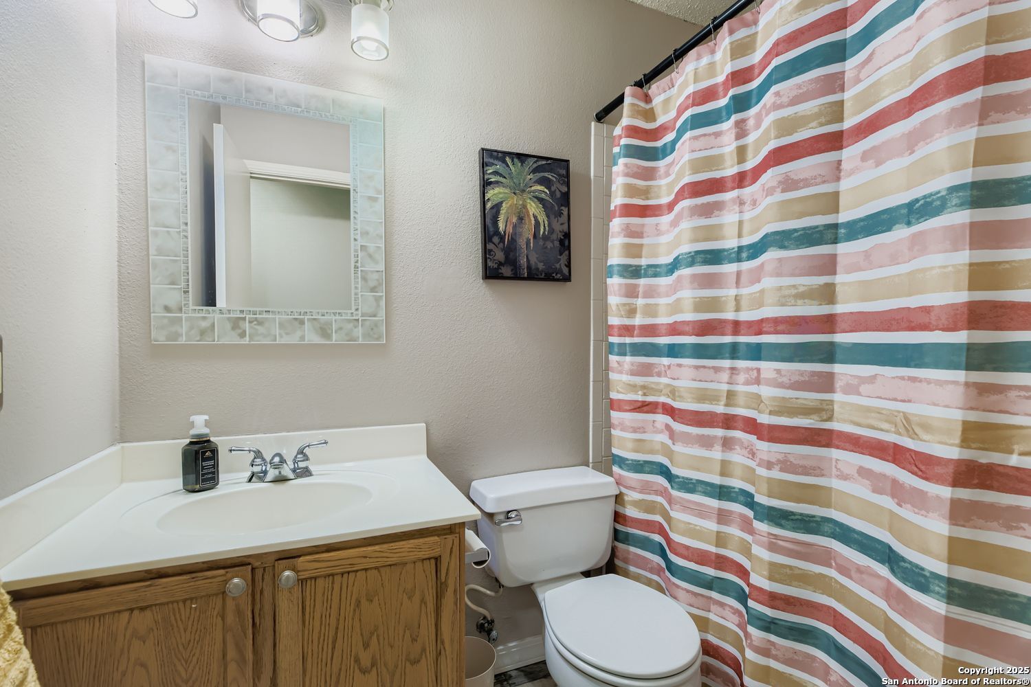 8614 Cross Spring San Antonio, TX 78251 - Photo 19 of 24 a bathroom with a sink toilet and shower