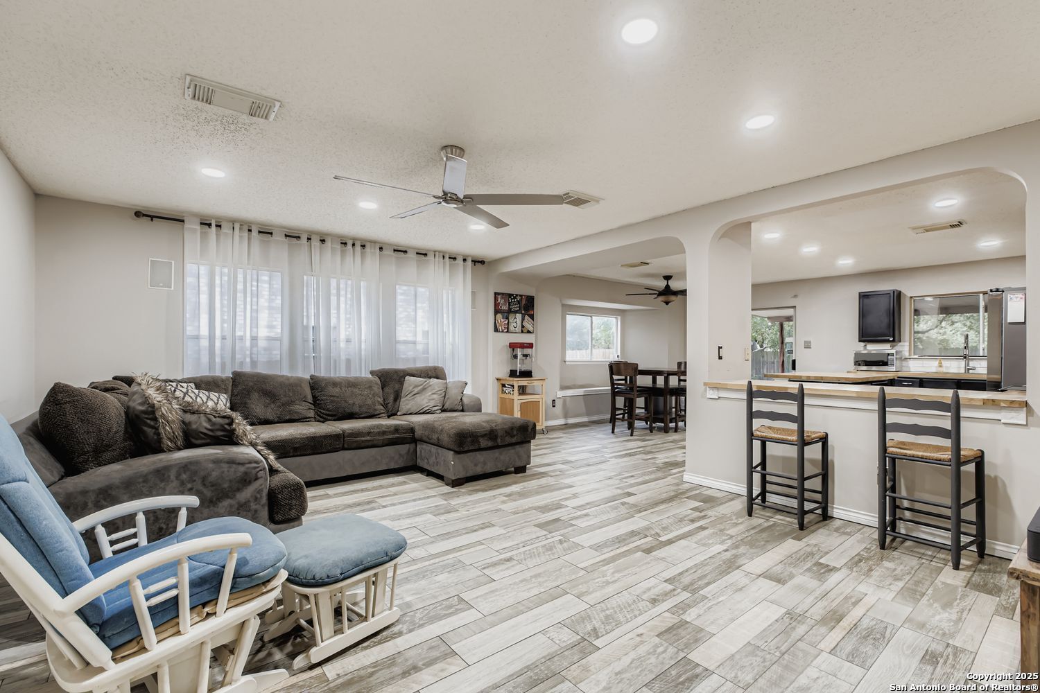 8614 Cross Spring San Antonio, TX 78251 - Photo 2 of 24 a living room with furniture and wooden floor