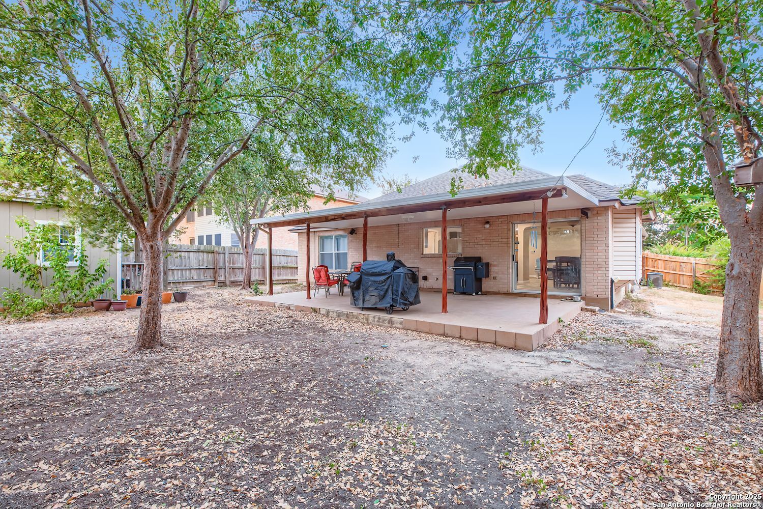 8614 Cross Spring San Antonio, TX 78251 - Photo 22 of 24 a view of a house with a backyard