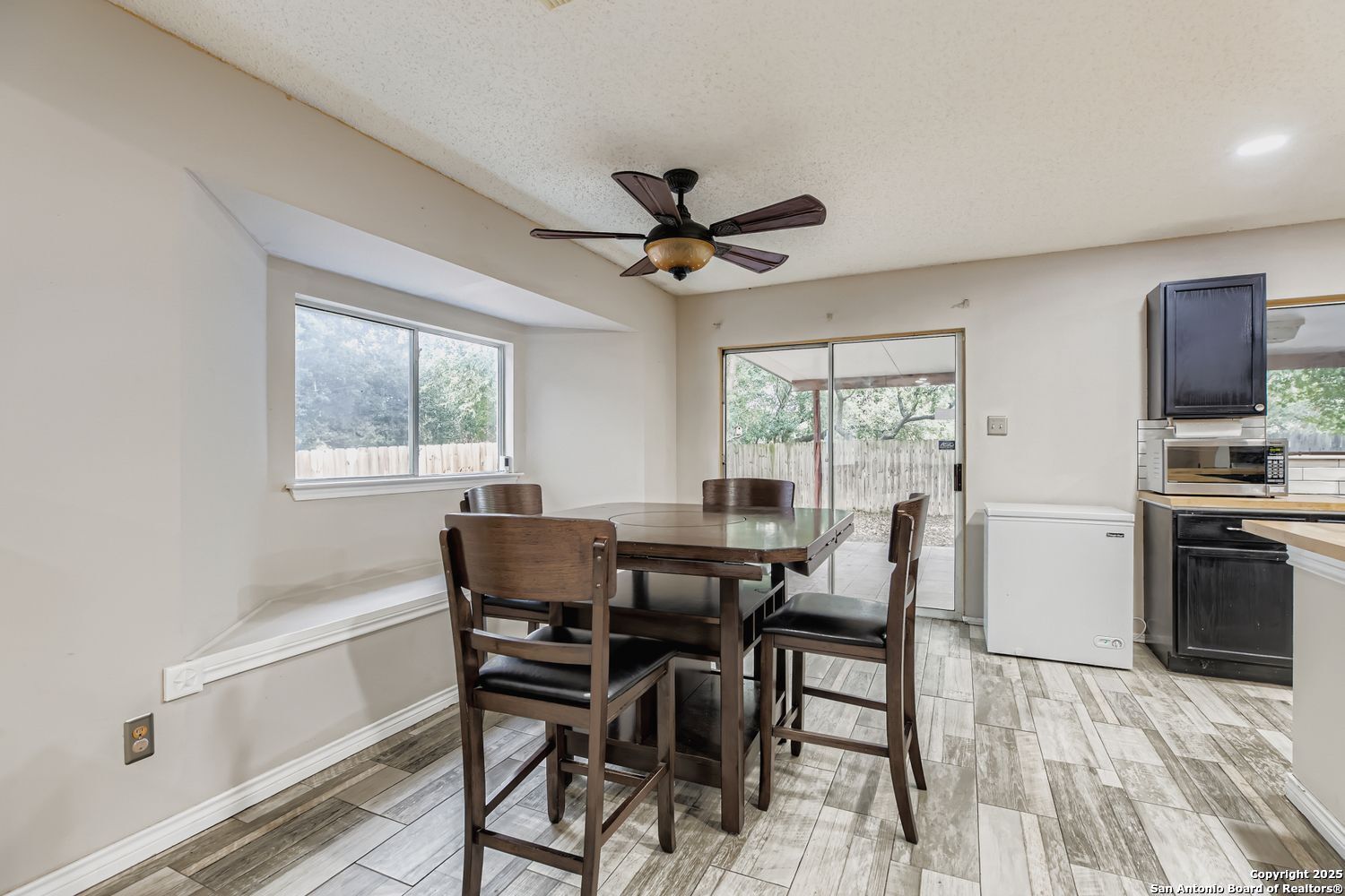 8614 Cross Spring San Antonio, TX 78251 - Photo 7 of 24 a view of a dining room with furniture window and outside view