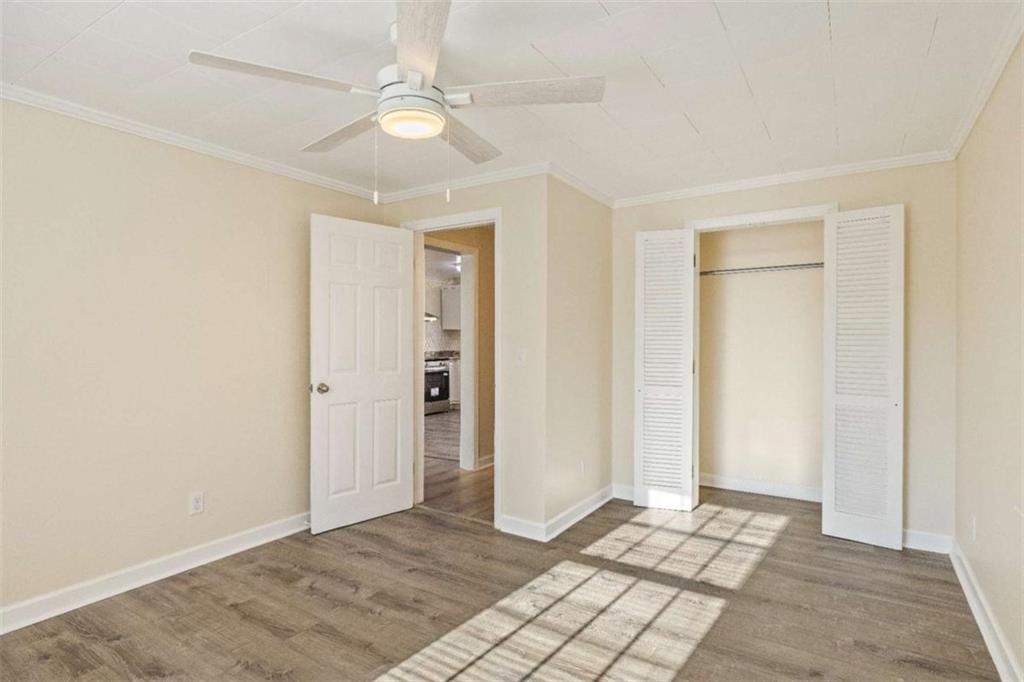 614 Burnett Ferry Road Southwest Rome, GA 30165 - Photo 10 of 29 wooden floor in an empty room with a window
