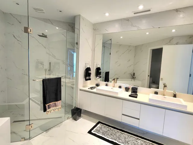 a bathroom with a tub a toilet and a sink