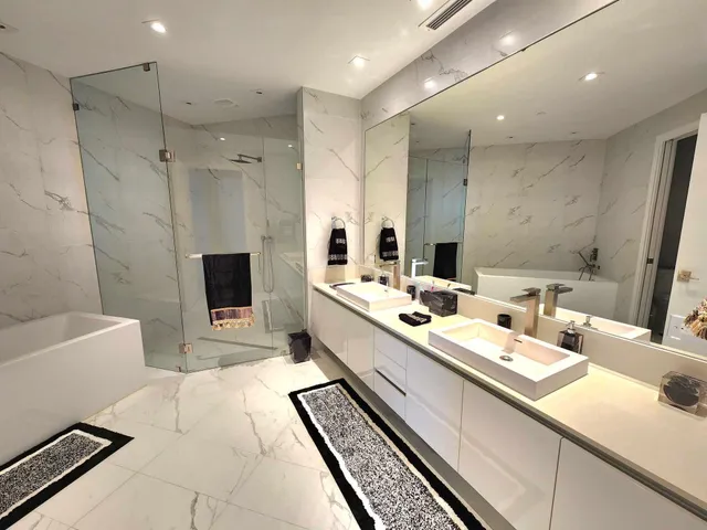 a bathroom with a bathtub and a shower