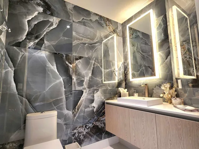 a room with a couch and a view of bathroom